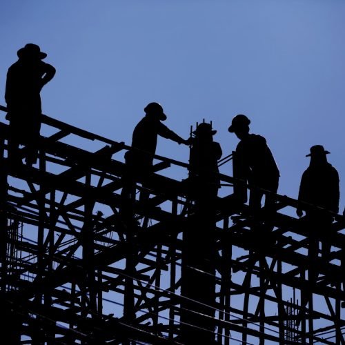 construction-worker-is-working-steel-roof-min