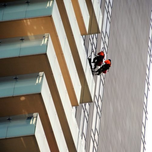 low-angle-view-people-working-building-min