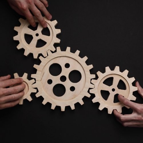 parts-wooden-mechanism-black-background-min